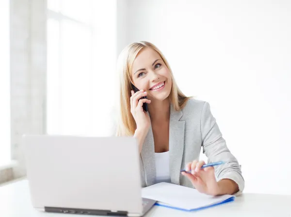 Clinic receptionist answering a phone call